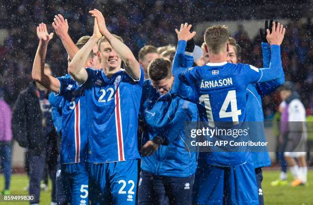 Iceland's players celebrate after the FIFA World Cup 2018 qualification football match between Iceland and Kosovo in Reykjavik, Iceland on October 9,...