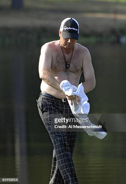 Doug Barron dries off after playing from a water hazard on the 16th hole during the first round of the 2006 Chrysler Championship Oct. 26 in Palm...