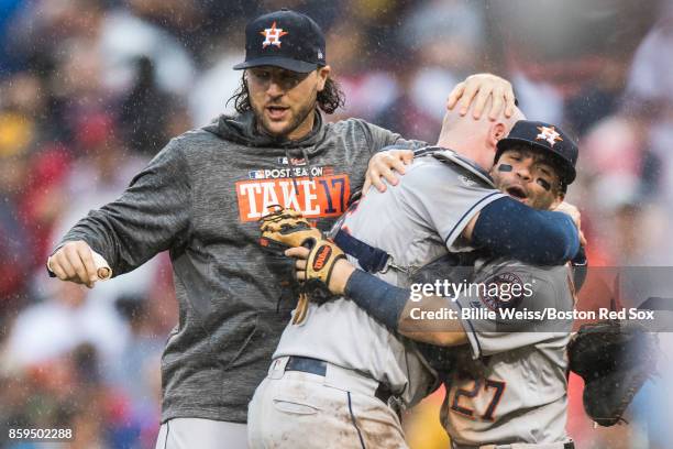 Jose Altuve and Brian McCann of the Houston Astros celebrate after recording the final out to clinch the series in game four of the American League...