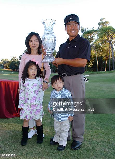 Choi poses with the trophy and his wife Hyunjung Kim, and children Amanda and Daniel, after winning the 2006 Chrysler Championship held at the Westin...