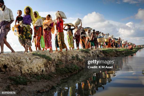 Hundreds of Rohingya people crossing Bangladesh's border as they flee from Buchidong at Myanmar after crossing the Naf River in Bangladesh. According...