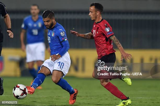 Lorenzo Insigne of Italy is challenged by Ergys Kace of Albania during the FIFA 2018 World Cup Qualifier between Albania and Italy at Loro Borici...