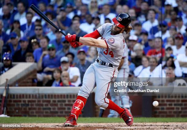 Bryce Harper of the Washington Nationals strikes out in the sixth inning against the Chicago Cubs during game three of the National League Division...