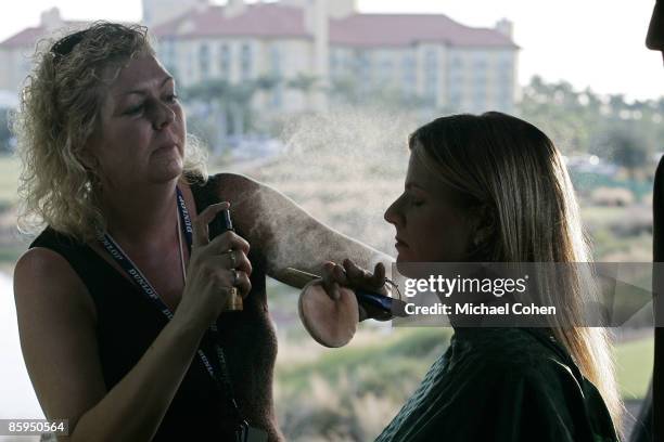 Kelly Tilghman, of the Golf Channel, gets makeup before broadcasting during the first round of the Merrill Lynch Shootout at the Tiburon Golf Club in...