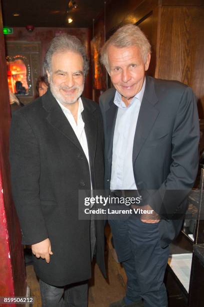 Raphael Mezrahi and Patrick Poivre D'Arvor attend "Carnets d'un Sale Gosse" Laurent Gerra Signing his book at Buddha Bar on October 9, 2017 in Paris,...