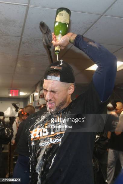 George Springer of the Houston Astros celebrates in the clubhouse after defeating the Boston Red Sox 5-4 in game four of the American League Division...