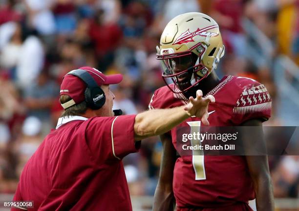 Head coach Jimbo Fisher talks with quarterback James Blackman of the Florida State Seminoles during the first half of an NCAA football game against...