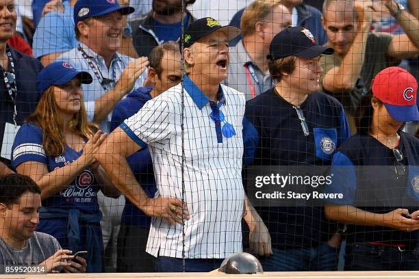 Actor Bill Murray cheers during game three of the National League Division Series between the Washington Nationals and the Chicago Cubs at Wrigley...