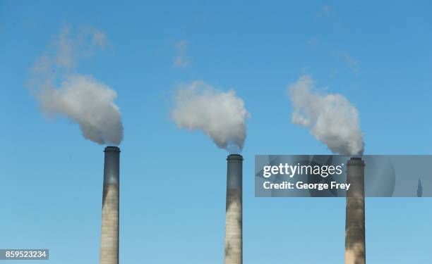 Emissions rise out of three large smoke stacks at Pacificorp's 1440 megawatt coal fired power plant on October 9, 2017 in Castle Dale, Utah. It was...