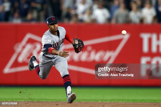 Francisco Lindor of the Cleveland Indians flips to second base for the final out of the first inning during Game 4 of the American League Division...