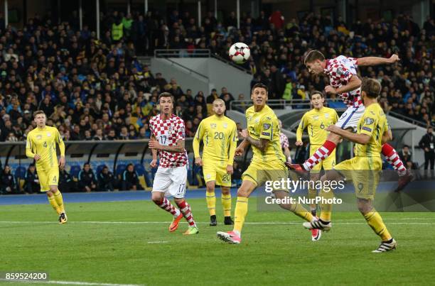 Croatian players Andrej Kramaric and Mario Mandzukic vies Yevhen Khacheridi of Ukraine during the FIFA 2018 World Cup Group I Qualifier between...