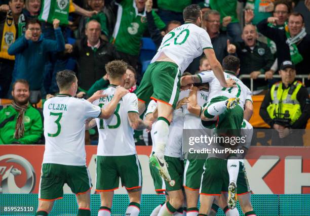 The Irish players celebrate scoring during the FIFA World Cup 2018 Qualifying Round Group D match between Wales and Republic of Ireland at Cardiff...