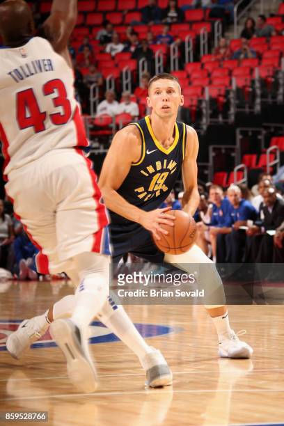 Jarrod Uthoff of the Indiana Pacers handles the ball against the Detroit Pistons on October 9, 2017 at Little Caesars Arena in Detroit, Michigan....