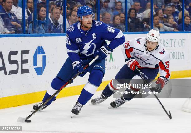 Steven Stamkos of the Tampa Bay Lightning skates against Aaron Ness of the Washington Capitals during the first period at Amalie Arena on October 9,...