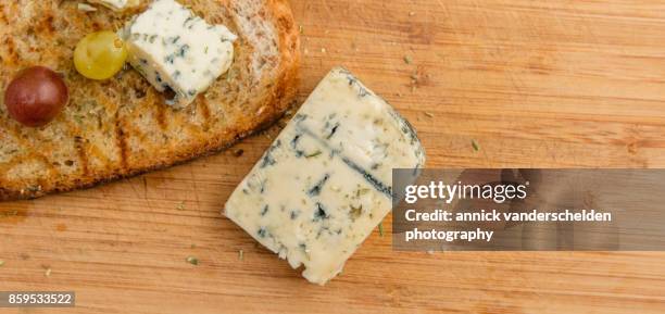 grilled bread with olive oil, grapes and blue d'auvergne. - moldy bread stock pictures, royalty-free photos & images