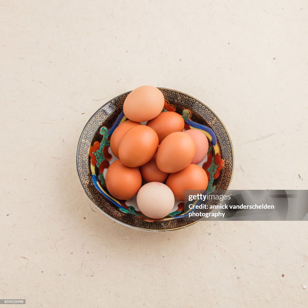 Eggs in a black decorative bowl.