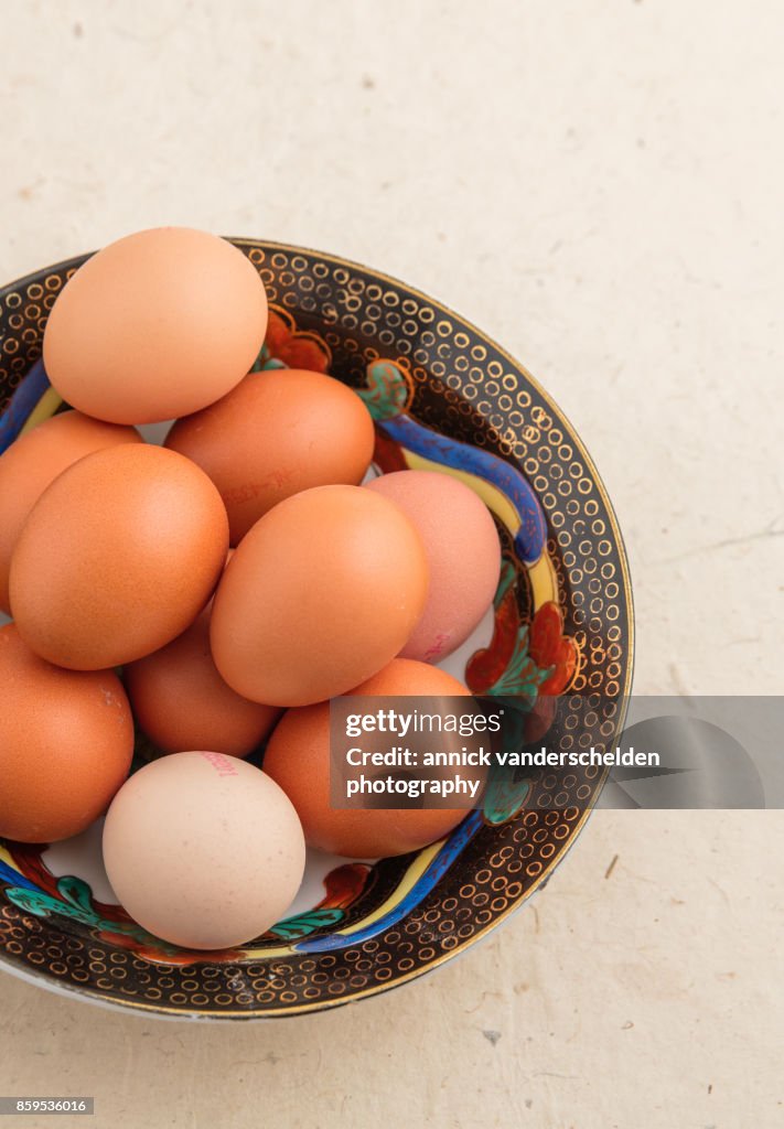 Eggs in a black decorative bowl.