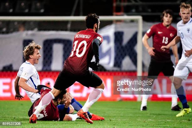 Hakan Calhanoglu of Turkey vie for the ball during the FIFA World Cup 2018 qualifying football match between Finland and Turkey in Turku, Southern...