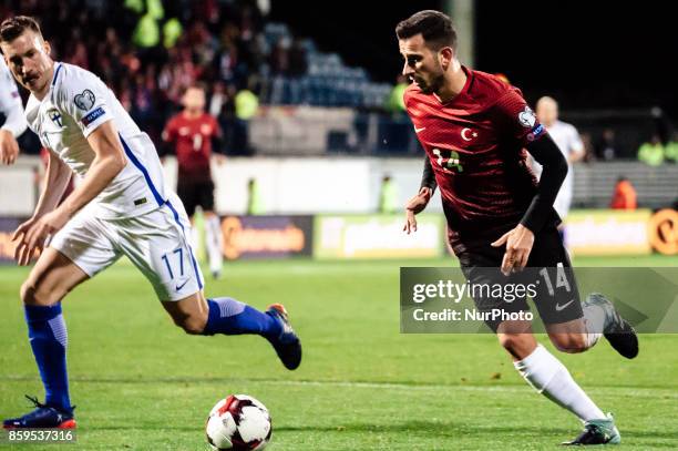 Finland's Juha Pirilä and Turkey's Oguzhan Özyakup during the FIFA World Cup 2018 qualification football match between Finland and Turkey in Turku,...