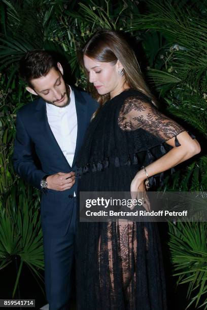 Pierre Niney and Natasha Andrews attend the "Diner des Amis de Care" at Hotel Peninsula Paris on October 9, 2017 in Paris, France.