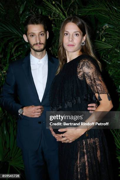 Pierre Niney and Natasha Andrews attend the "Diner des Amis de Care" at Hotel Peninsula Paris on October 9, 2017 in Paris, France.