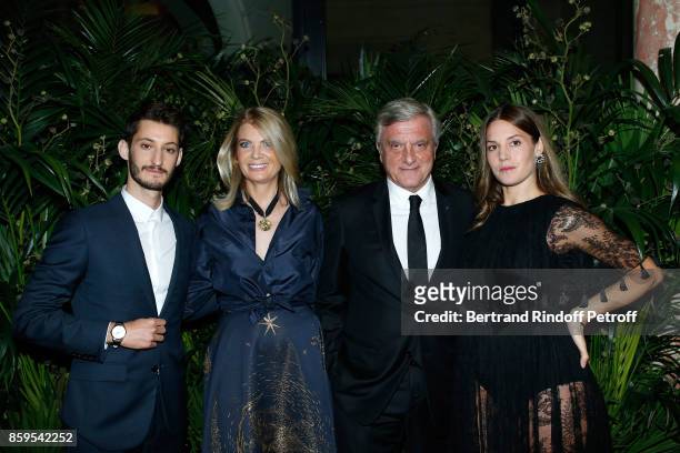 Pierre Niney, President of Care France, Arielle de Rothschild, CEO Dior Sidney Toledano and Natasha Andrews attend the "Diner des Amis de Care" at...