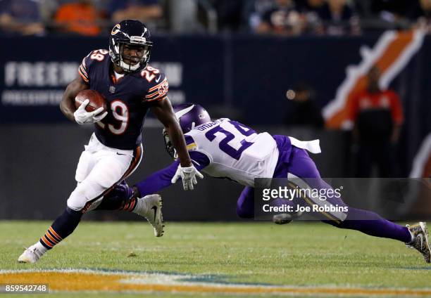 Tramaine Brock of the Minnesota Vikings attempts to tackle Tarik Cohen of the Chicago Bears in the first quarter at Soldier Field on October 9, 2017...