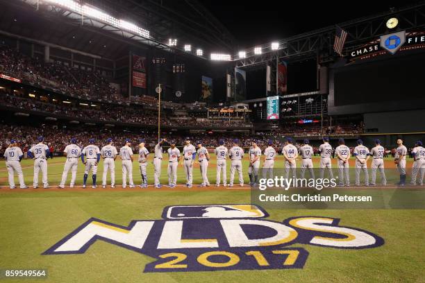 Members of the Los Angeles Dodgers line up before the start of the National League Divisional Series game three against the Arizona Diamondbacks at...