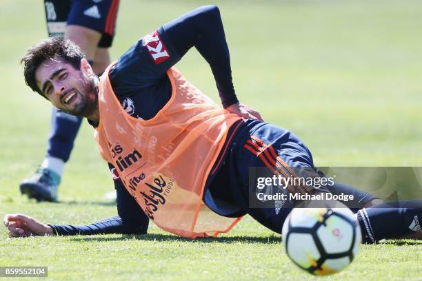 Rhys Williams feels for his back after a contest during a Melbourne Victory A-League training session at Gosch's Paddock on October 10, 2017 in...