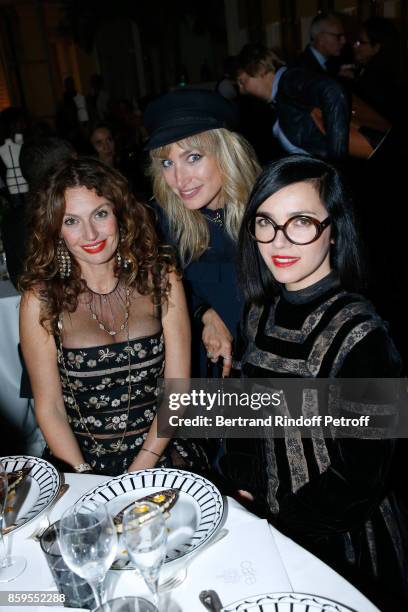 Pauline Lefevre standing between Members of Musical Group "Brigitte", Aurelie Saada and Sylvie Hoarau attend the "Diner des Amis de Care" at Hotel...