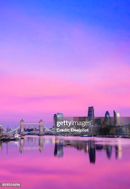 city of london downtown skyline and river thames with glowing sunset, united kingdom - london tower bridge stock pictures, royalty-free photos & images