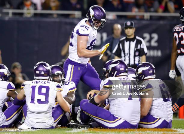 Kyle Rudolph of the Minnesota Vikings celebrates after scoring against the Chicago Bears in the third quarter at Soldier Field on October 9, 2017 in...