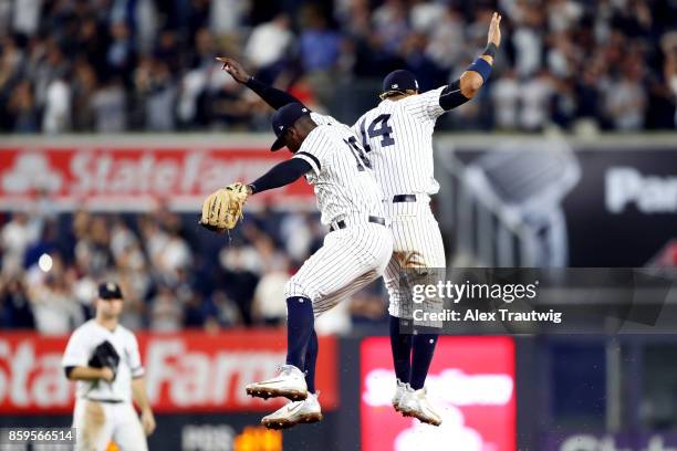 Didi Gregorius and Starlin Castro of the New York Yankees celebrate after the Yankees defeated the Cleveland Indians in Game 4 of the American League...