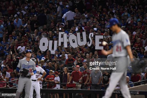 Arizona Diamondbacks fans hold a sign during the third inning of the National League Divisional Series game three against the Los Angeles Dodgers at...