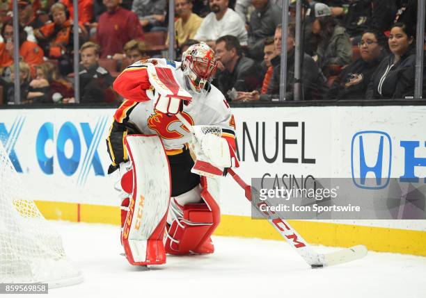 Calgary Flames Goalie Mike Smith plays the puck in the trapezoid during an NHL game between the Calgary Flames and the Anaheim Ducks on October 09,...