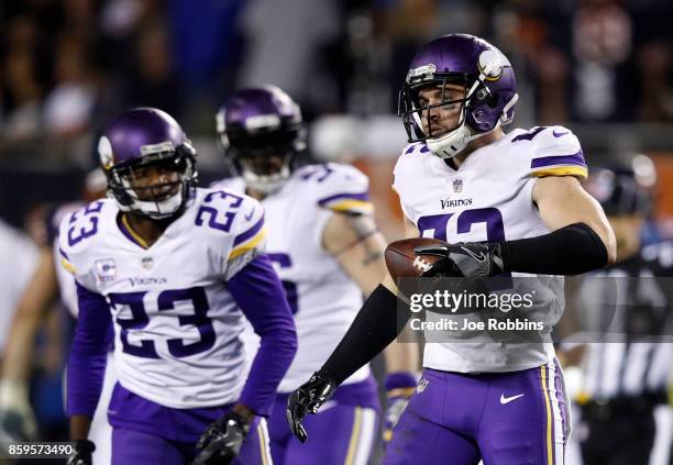 Harrison Smith of the Minnesota Vikings reacts after intercepting the football in the fourth quarter against the Chicago Bears at Soldier Field on...