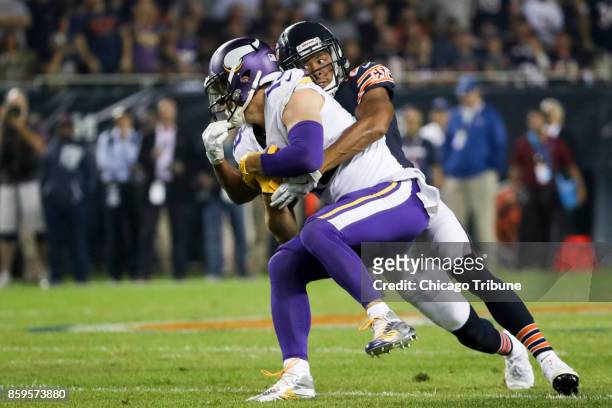 Chicago Bears cornerback Kyle Fuller tackles Minnesota Vikings wide receiver Adam Thielen during the first half at Soldier Field Monday, Oct. 9, 2017...