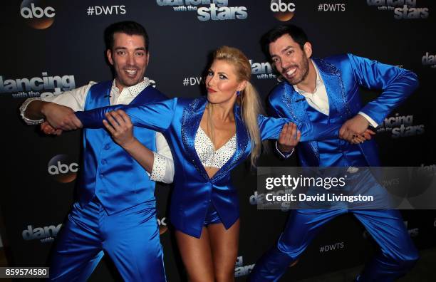 Personalities Jonathan Scott and Drew Scott pose with dancer Emma Slater at "Dancing with the Stars" season 25 at CBS Televison City on October 9,...