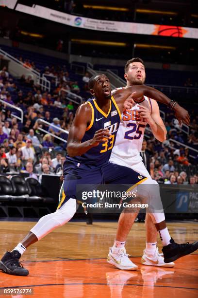 Ekpe Udoh of the Utah Jazz boxes out against Alec Peters of the Phoenix Suns on October 9, 2017 at Talking Stick Resort Arena in Phoenix, Arizona....