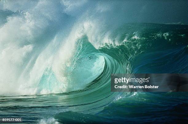 breaking ocean wave, view along 'tube' - tube wave stock pictures, royalty-free photos & images