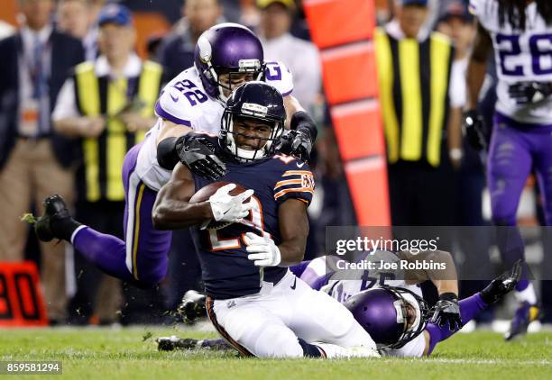 Tarik Cohen of the Chicago Bears is tackled by Harrison Smith of the Minnesota Vikings in the fourth quarter at Soldier Field on October 9, 2017 in...