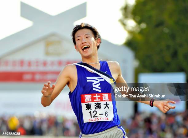 6th and final runner Hayato Seki of Tokai University crosses the finish tape to win the 29th Izumo Ekiden at Izumo Dome on October 9, 2017 in Izumo,...