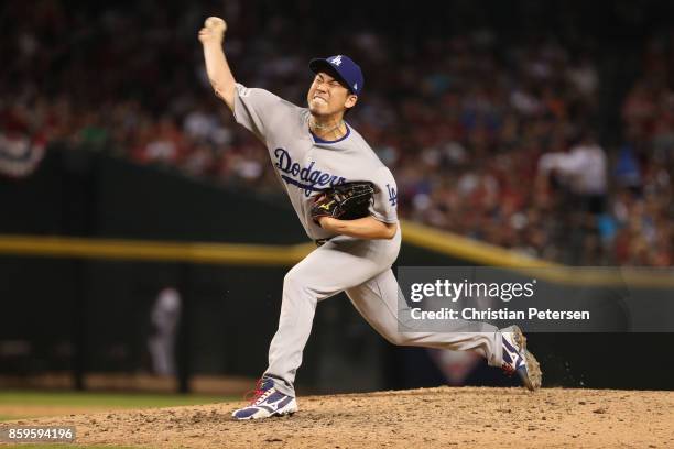 Relief pitcher Kenta Maeda of the Los Angeles Dodgers throws during the eighth inning of the National League Divisional Series game three against the...