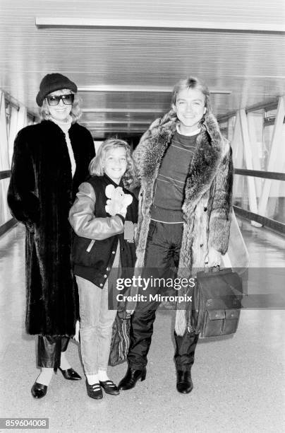 David Cassidy, singer, actor and musician, in 1985. David, his wile Mell, and 9 year old daughter Caroline arrive at Heathrow Airport in London for a...