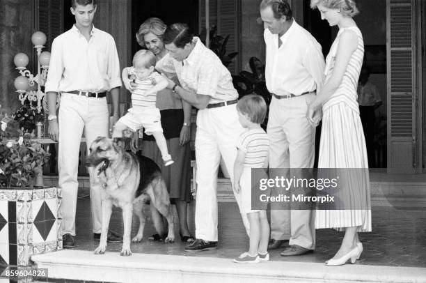 Prince Harry befriends the family dog. Rest of this picture set : Princess Diana,The Princess of Wales and her husband Prince Charles, The Prince of...