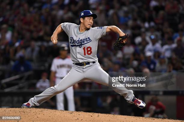 Pitcher Kenta Maeda of the Los Angeles Dodgers throws during the eighth inning of the National League Divisional Series game three against the...