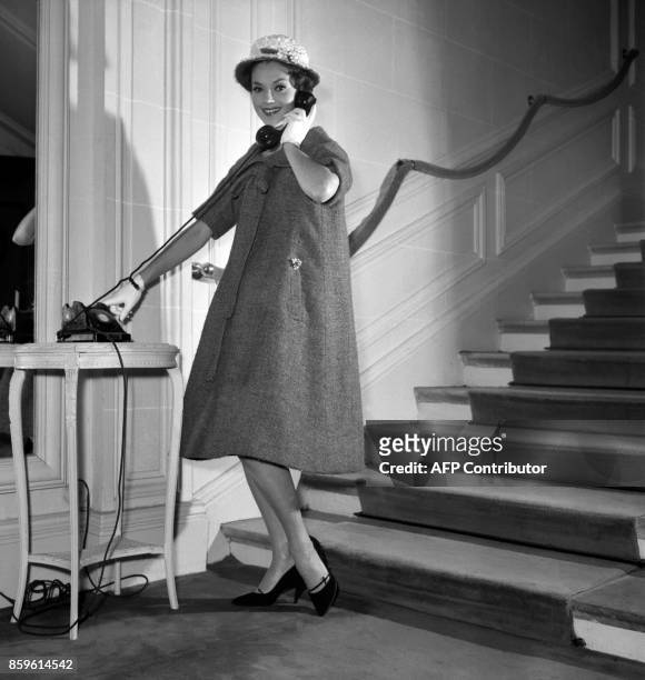 Model poses for the presentation of the first Yves Saint-Laurent's Dior collection, 04 February 1958, Avenue Montaigne in Paris. With this...