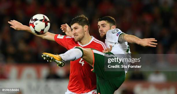 Wales player Ben Davies is challenged by Robbie Brady of Ireland during the FIFA 2018 World Cup Qualifier between Wales and Republic of Ireland at...