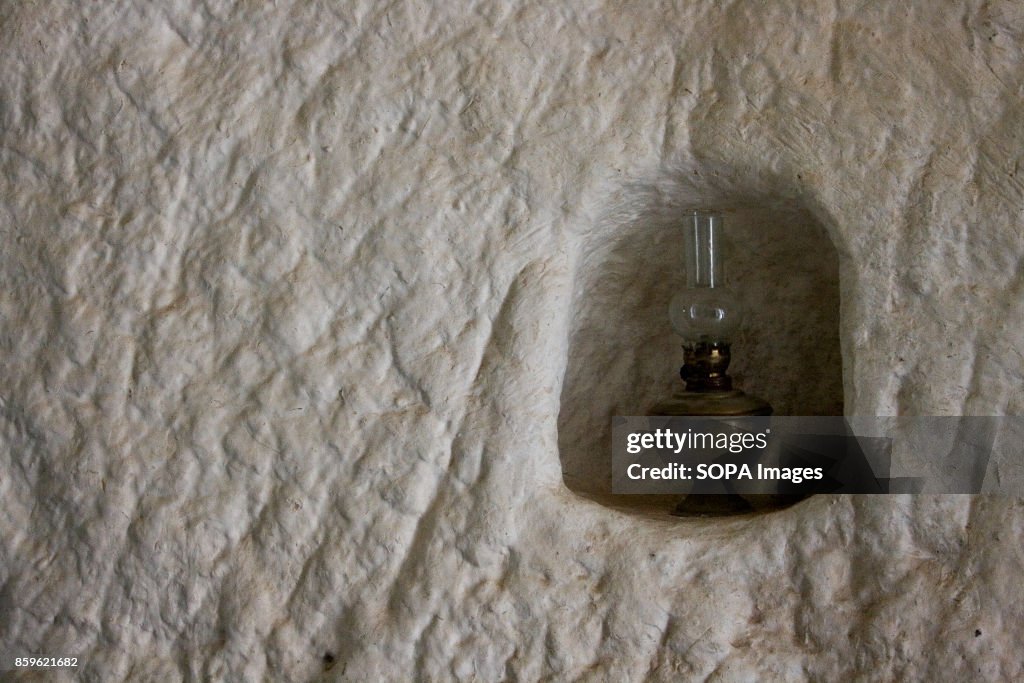 An old oil lamp is seen inside a local house.
The tiny...