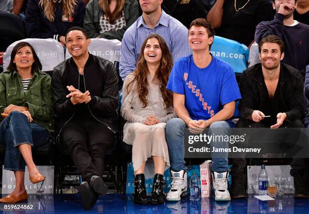 Guest, Trevor Noah, Violetta Komyshan, Ansel Elgort and Paul Wesley attend Houston Rockets Vs. New York Knicks game at Madison Square Garden on...